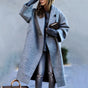 Women's long lapel coat with single button and front pockets