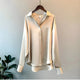 Women's long-sleeve button-front shirt blouse with pointed collar and curved hem