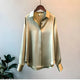 Women's long-sleeve button-front shirt blouse with pointed collar and curved hem