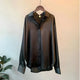 Women's long-sleeve button-front shirt blouse with pointed collar and curved hem