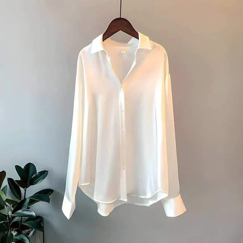 Women's long-sleeve button-front shirt blouse with pointed collar and curved hem