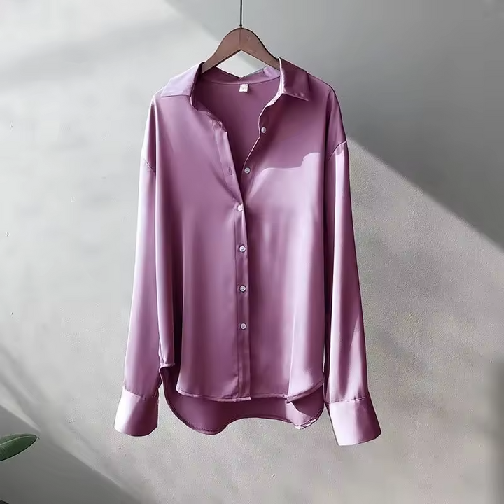 Women's long-sleeve button-front shirt blouse with pointed collar and curved hem