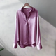 Women's long-sleeve button-front shirt blouse with pointed collar and curved hem