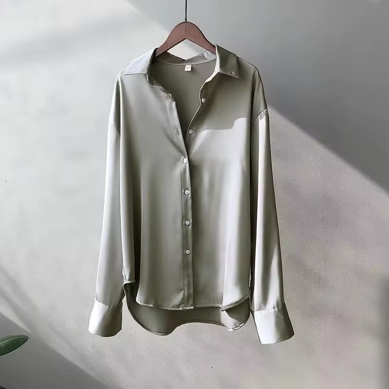 Women's long-sleeve button-front shirt blouse with pointed collar and curved hem