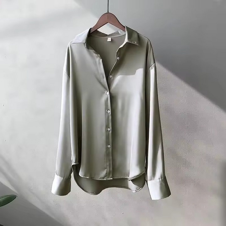 Women's long-sleeve button-front shirt blouse with pointed collar and curved hem