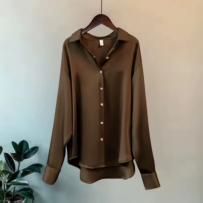 Women's long-sleeve button-front shirt blouse with pointed collar and curved hem