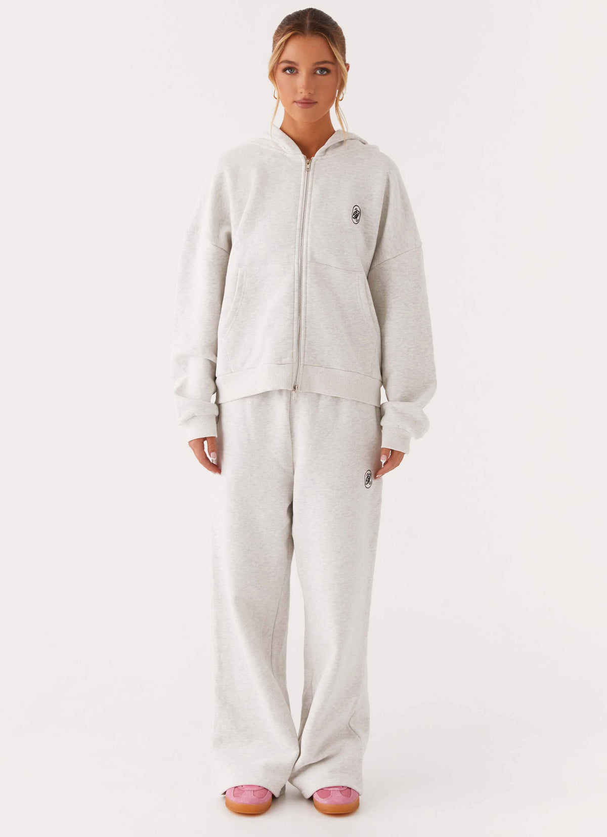 Women's grey oversized zip-up hoodie with hood and kangaroo pockets