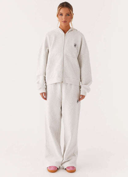 Women's grey oversized zip-up hoodie with hood and kangaroo pockets