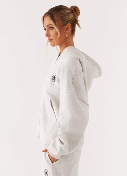 Women's grey oversized zip-up hoodie with hood and kangaroo pockets
