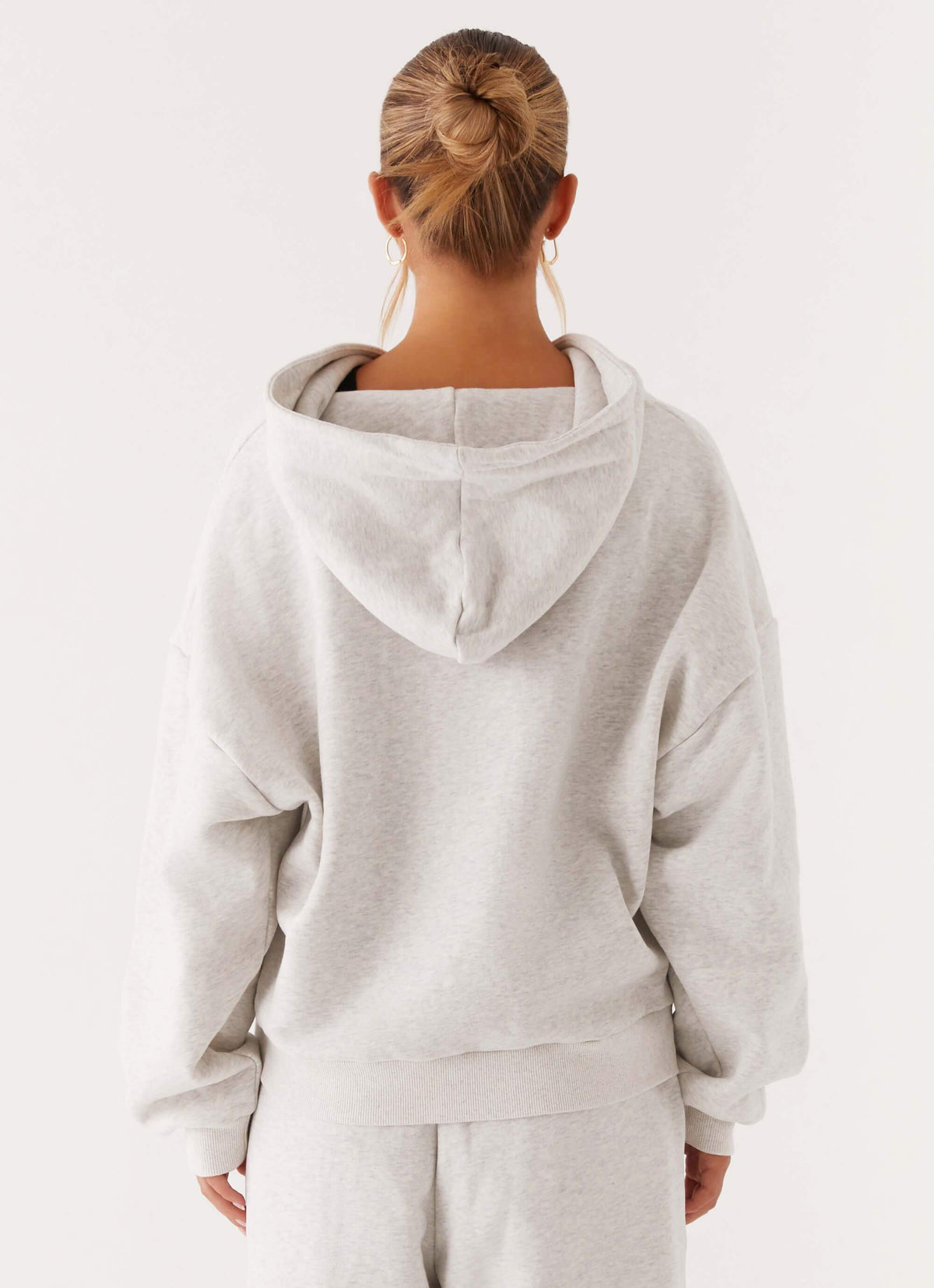 Women's grey oversized zip-up hoodie with hood and kangaroo pockets