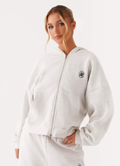 Women's grey oversized zip-up hoodie with hood and kangaroo pockets