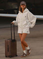 Women's grey oversized zip-up hoodie with hood and kangaroo pockets
