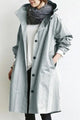 Women's long hooded raincoat with button front and patch pockets