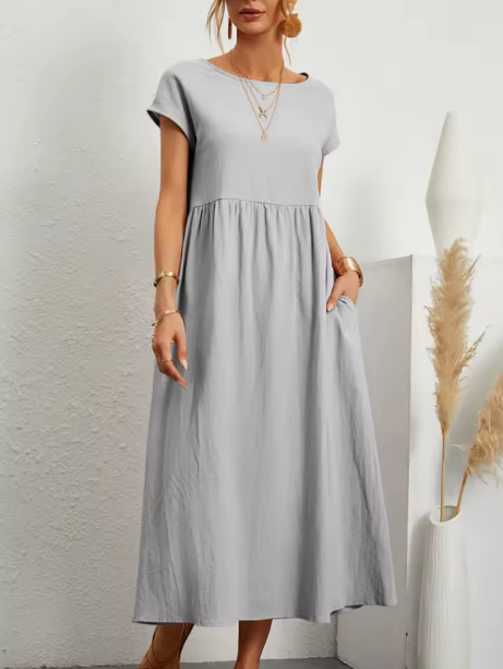 Women's flowing midi dress with round neck and short sleeves, shown in white and navy