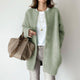 Women's long textured button front cardigan with patch pockets