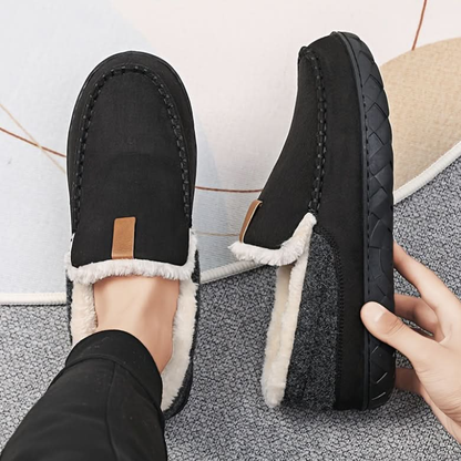 Men's slip-on moc toe slippers with plush lining and flat textured soles