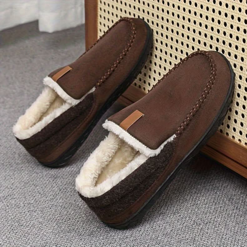 Men's slip-on moc toe slippers with plush lining and flat textured soles