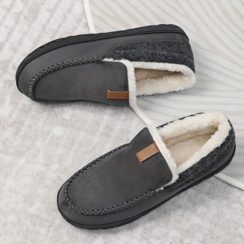 Men's slip-on moc toe slippers with plush lining and flat textured soles