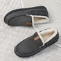 Men's slip-on moc toe slippers with plush lining and flat textured soles