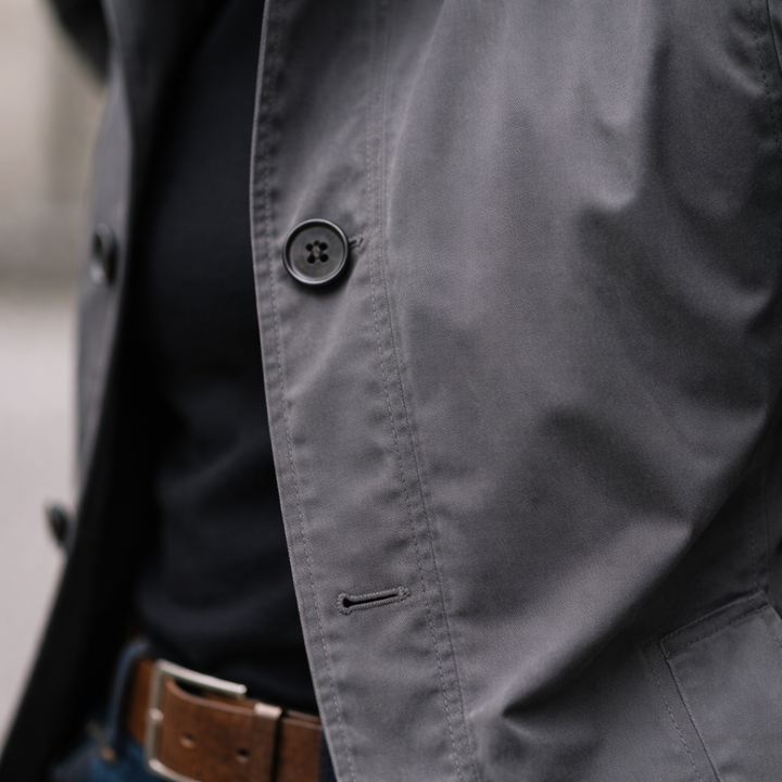 Men's longline trench coat with pointed collar, button front and side pockets