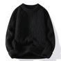 Men's cable knit crewneck sweater with long sleeves and ribbed trims