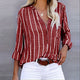 Women's striped V-neck blouse with long sleeves and button front