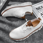 Men's textured lace-up sneakers with round toes and flat segmented soles