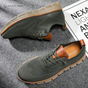 Men's textured lace-up sneakers with round toes and flat segmented soles
