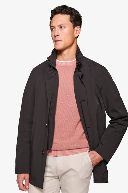 Men's black stand collar jacket with zip front and button details