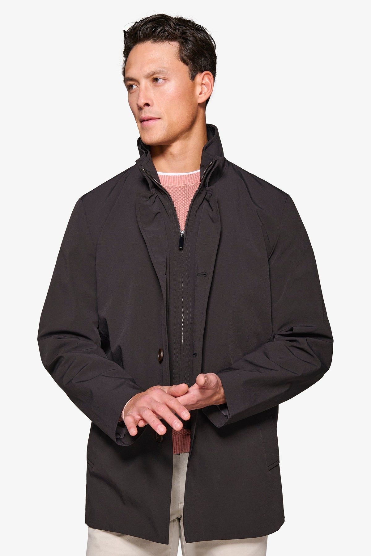 Men's black stand collar jacket with zip front and button details