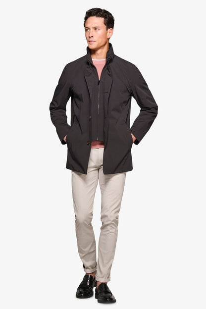 Men's black stand collar jacket with zip front and button details
