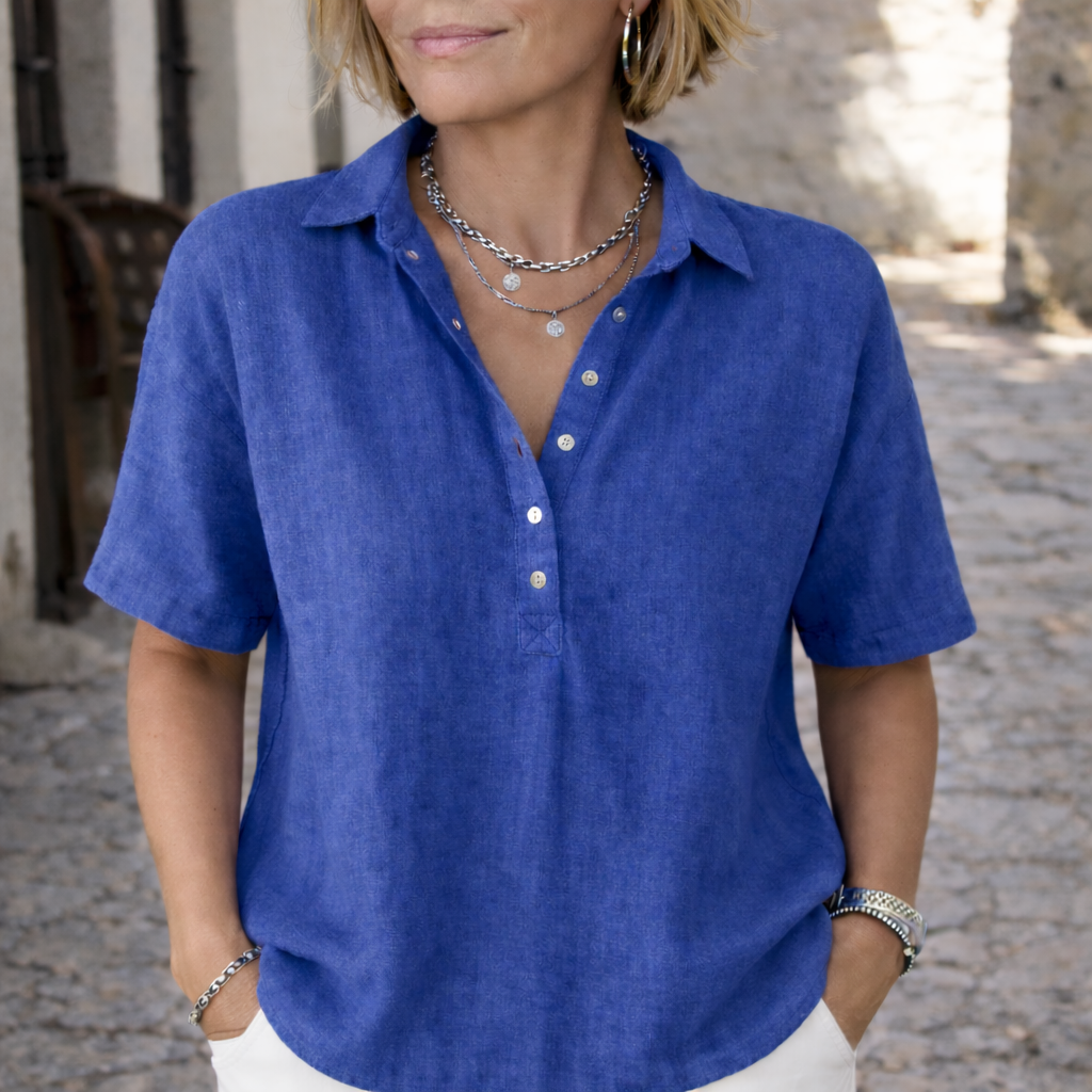 Women's short sleeve collared button blouse with polo neckline