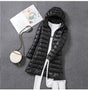 Women's hooded longline puffer coat with quilted panels and zip front