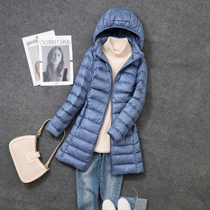 Women's hooded longline puffer coat with quilted panels and zip front