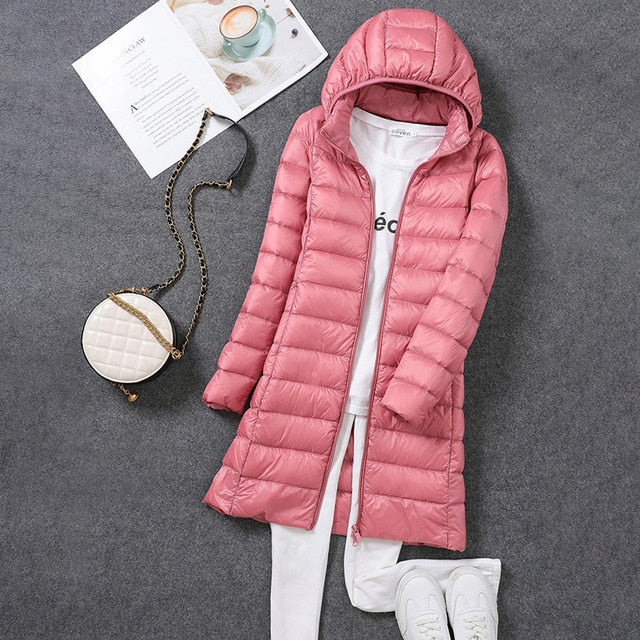 Women's hooded longline puffer coat with quilted panels and zip front