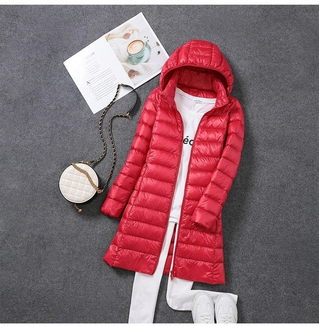 Women's hooded longline puffer coat with quilted panels and zip front