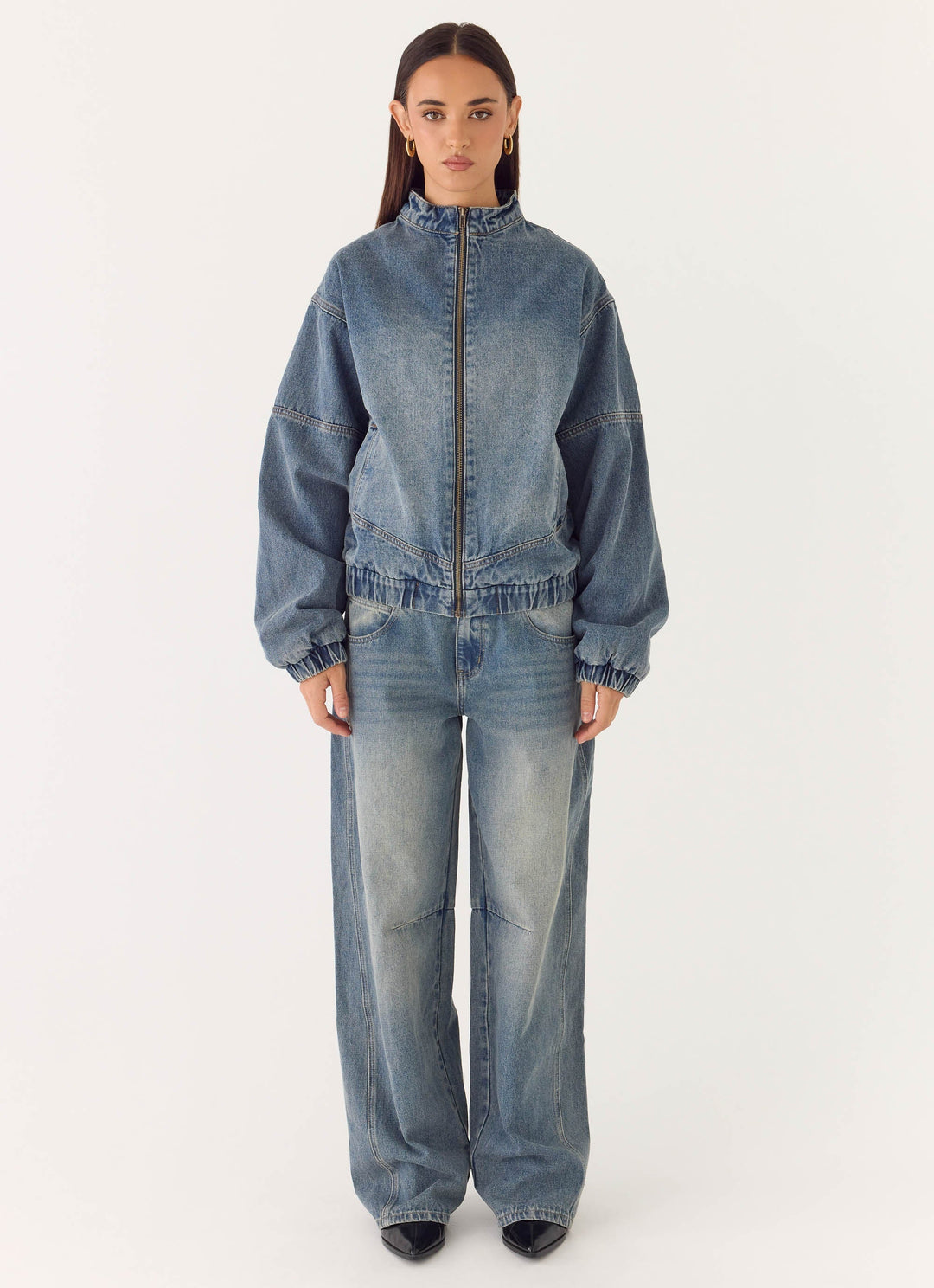 Women's blue denim bomber jacket with stand collar and cropped fit