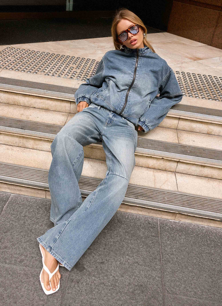 Women's blue denim bomber jacket with stand collar and cropped fit