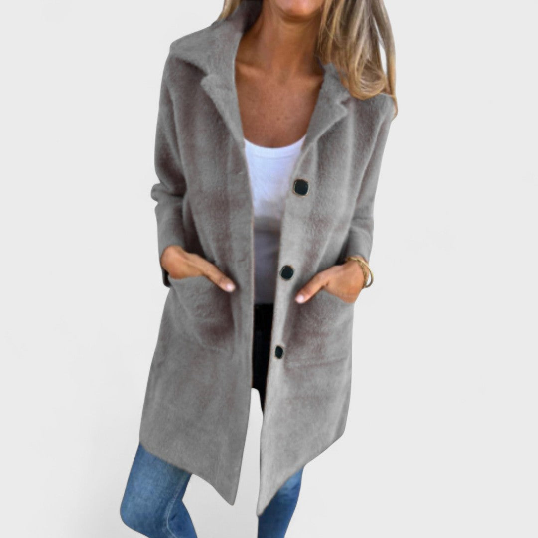 Women's longline textured coat with notched lapels, buttons and front pockets