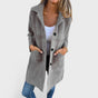 Women's longline textured coat with notched lapels, buttons and front pockets