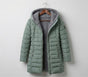 Quilted hooded women's winter coat with long sleeves and zip pockets