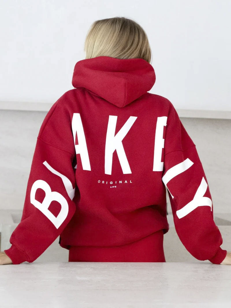 Women's hooded pullover with graphic back and sleeve print