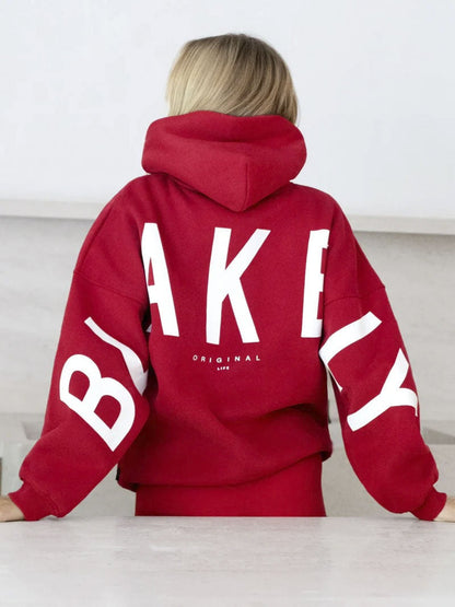 Women's hooded pullover with graphic back and sleeve print