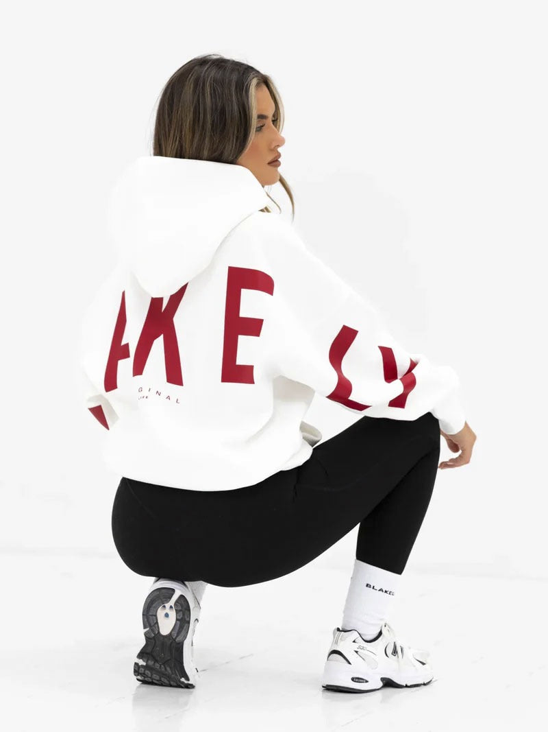 Women's hooded pullover with graphic back and sleeve print