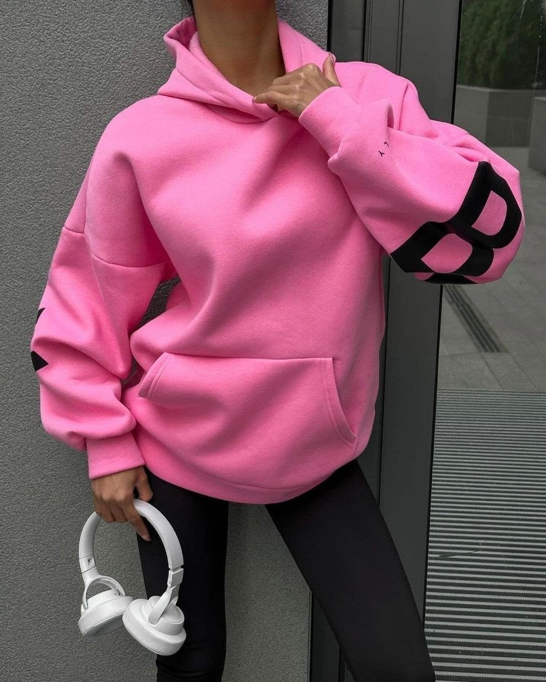 Women's hooded pullover with graphic back and sleeve print