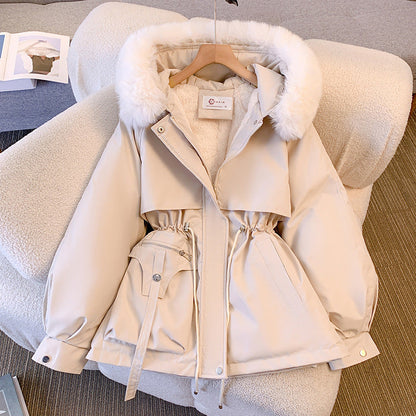 Women's hip-length parka jacket with fur-trimmed hood, drawstring waist and multiple pockets