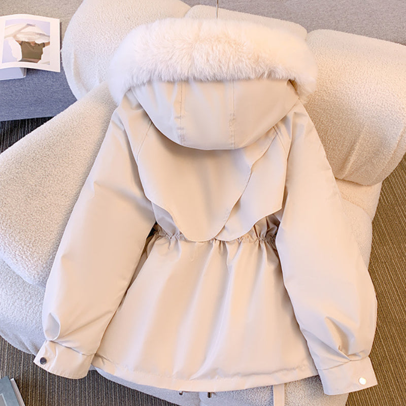 Women's hip-length parka jacket with fur-trimmed hood, drawstring waist and multiple pockets