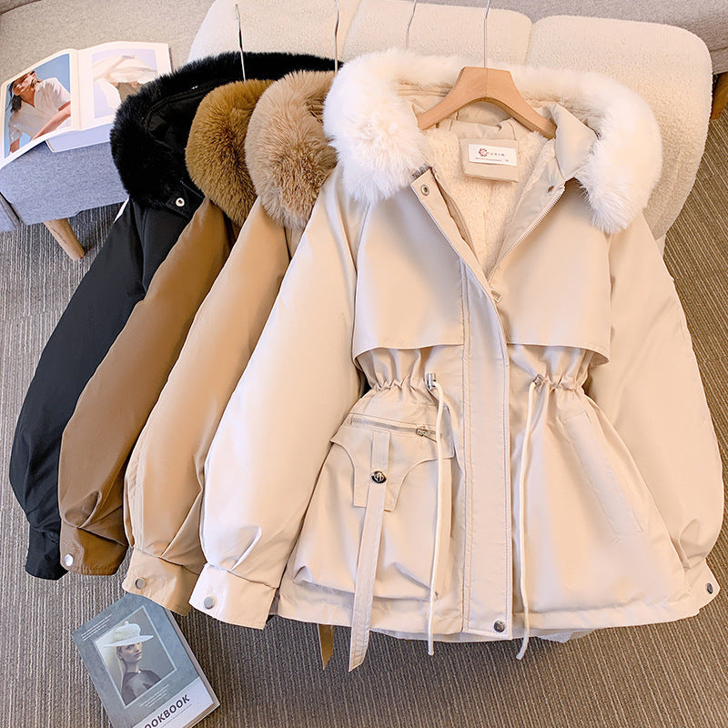 Women's hip-length parka jacket with fur-trimmed hood, drawstring waist and multiple pockets