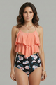 Woman wearing a black ruffled tankini top with high-waist leopard print bottom