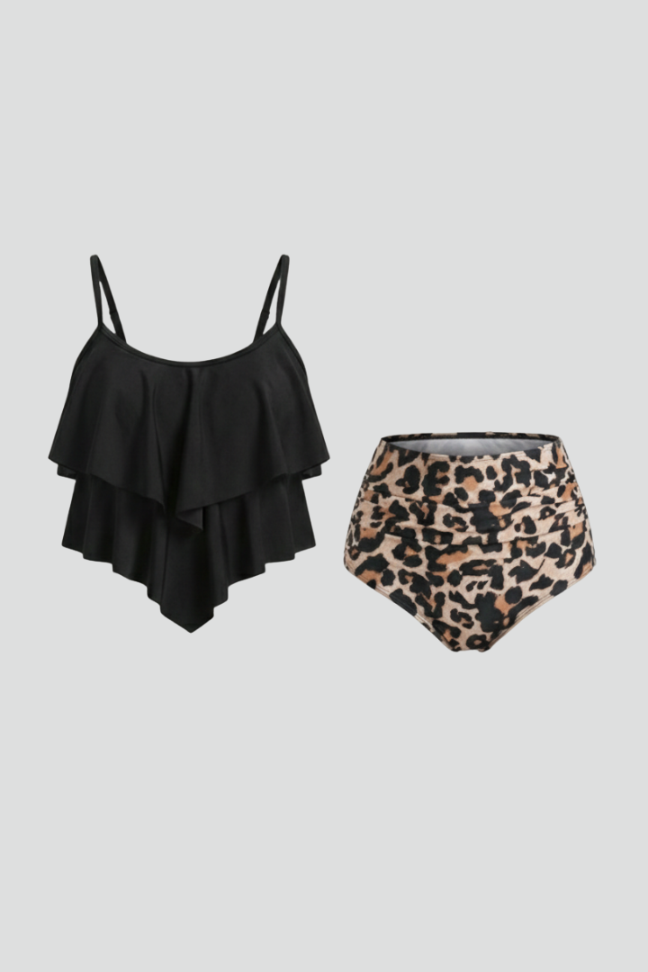 Woman wearing a black ruffled tankini top with high-waist leopard print bottom